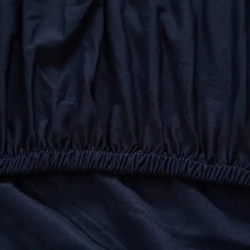 housse-de-fauteuil-extensible-bleu-nuit – La Maison de la Housse
